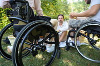 Outdoor Summer Gathering with People in Wheelchairs Enjoying Time Together